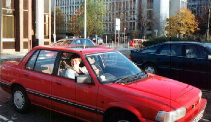 Rosemary in her red car with numberplate starting HRN (Her Royal Naughtiness)